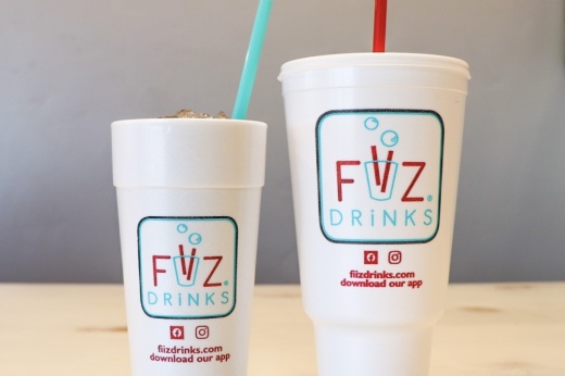 Two Fiiz Drinks cups with straws