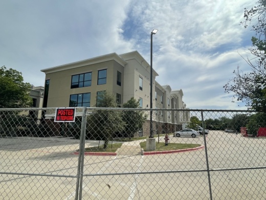 Concerns regarding the plan for the former hotel have centered on a lack of several major resources nearby, including public transit, mental health care and accessible grocery stores. (Claire Shoop/Community Impact Newspaper)