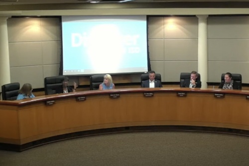 North East ISD Trustee Terri Williams (second from left) makes a point to fellow school board members and Superintendent Sean Maika (third from right) during the board's June 20 meeting. (Courtesy North East ISD)