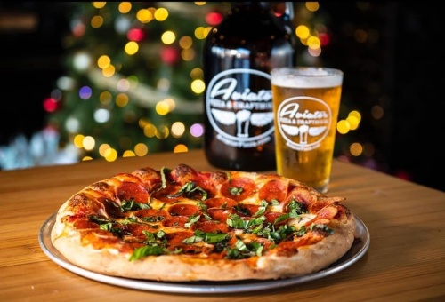 Pizza with two glasses of beer 