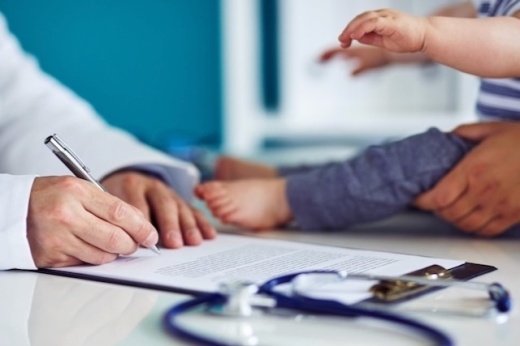 A doctor with a parent and child
