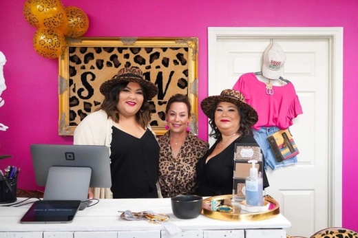 Co-owner Daniella Torres, employee Londie Lane and co-owner Nicole Flores pose at their boutique clothing store Sassy & Wild Boutique. The store held its grand opening April 30. (Courtesy Sassy & Wild)