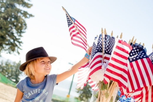 Child with American flags.