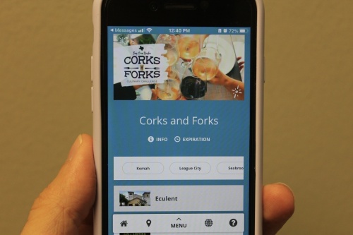 Phone screen shows Corks and Forks website