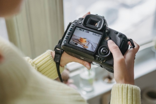 woman holding digital camera