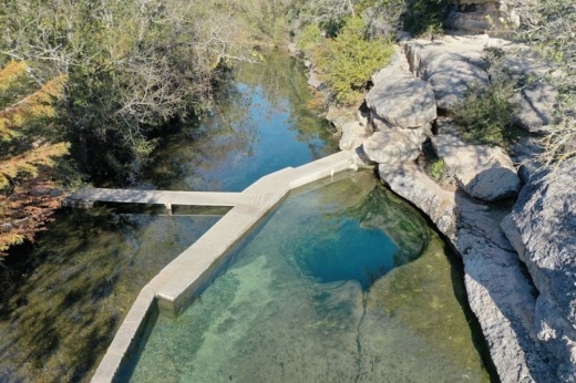 an image of the main spring and cavern entrance of Jacob's Well