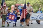 children walking in fourth of july parade