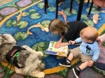 Readers ages six to 14 can sign up for 10-minute time slots to work on their skills with therapy dogs on July 16 through a partnership with The Dog Alliance. (Courtesy The Dog Alliance)