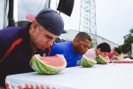 Attendees of Cornerstone Church’s 2021 Fourth of July celebration take part in a watermelon-eating contest. The Stone Oak church will commemorate Independence Day with daylong activities on July 3. (Courtesy Cornerstone Church) 
