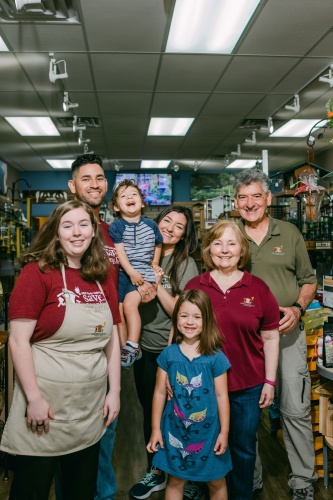 Wild Birds Unlimited owners Manuel and Anna Peña (right), with their daughter, Amanda Peña Bustillos (center), her husband, Hector Bustillos, their children Camila and Joaquin, and employee Kenzie Reitler (left). (Courtesy Wild Birds Unlimited/Claire Mulkey)
