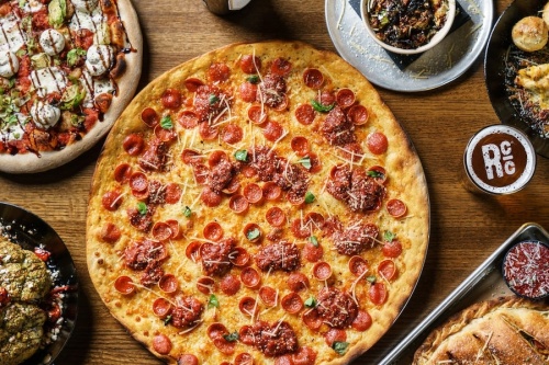 The Louisiana-based pizzeria offers 13-inch specialty craft pizzas, Chicago deep-dish pizzas and 18-inch thin-crust pizzas alongside craft beer on draft. (Courtesy Rotolo's)