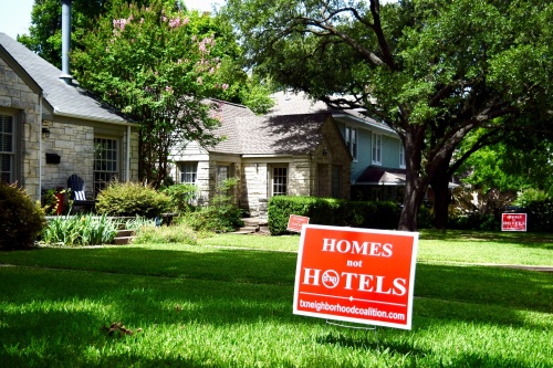 Signs denouncing short-term rentals populate more than a dozen front lawns around the Lakewood Heights area of Dallas. (Matt Payne/Community Impact Newspaper)