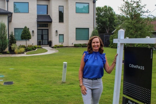 woman standing outside house
