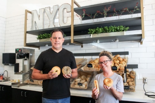 Owner Kurt Crowley (left) and manager Julie Carranza (right) offer a variety of bagels and bagel dogs at Fuhgedaboudit Bagel Co. (Photos by Andrew Christman)