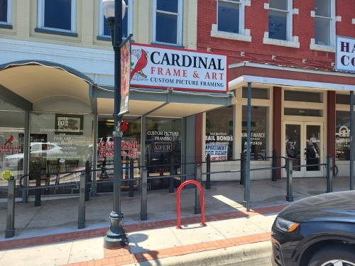 The Cardinal Frame & Art storefront is located downtown San Marcos. (Photos by Timia Cobb/Community Impact Newspaper)