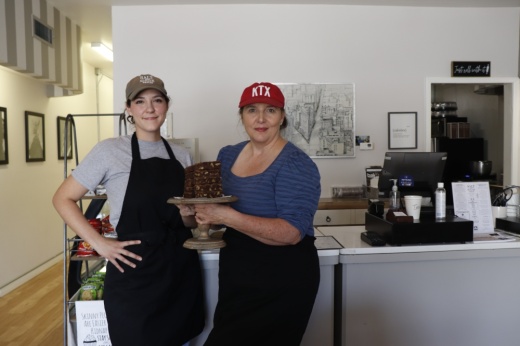 General Manager Ashlyn Winchester (left) and founder Susanne Behrens pose with brownies (Ilana Williams/Community Impact Newspaper)