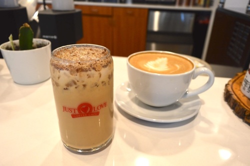 Just Love Coffee serves a variety of caffeinated beverages, including an iced white chocolate tiramisu and a traditional macchiato. (Hunter Terrell/Community Impact Newspaper)