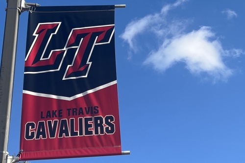 lake travis cavaliers flag with blue sky in background 