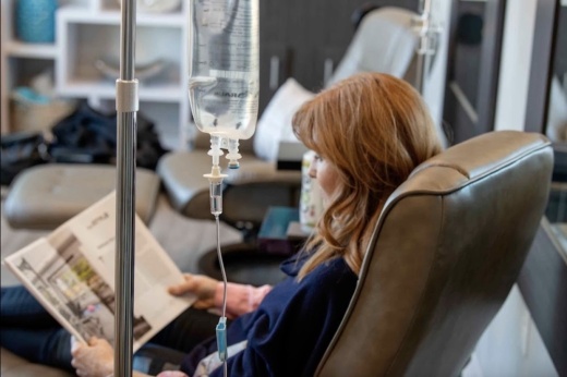 a woman receiving a drip infusion