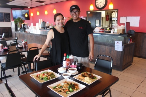 Wife-husband team Vi Li and Trieu To, owners of Red Lotus Asian Grille, work full time to run their restaurants. (Sumaiya Malik/Community Impact Newspaper)