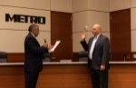Sanjay Ramabhadran (left), chair of METRO's board of directors, swears in Roberto Treviño, Harris County Toll Road Authority executive director, to the board. (Courtesy METRO)