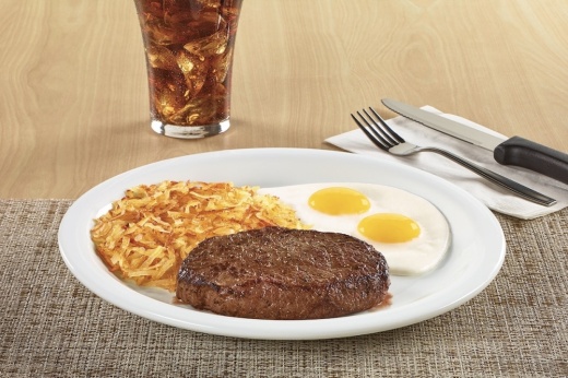sirloin steak served with eggs and hashbrowns