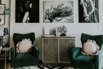 green chairs in room with black and white wall art