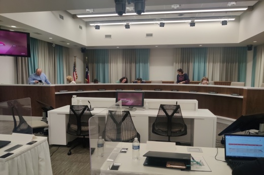 AISD Board of Trustees members return from receiving legal advice during executive session at an Aug. 9 meeting. (Zach Keel/Community Impact Newspaper)