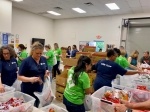 
Backpack Friends volunteers fill food kits during Monday night packing parties. (Courtesy Backpack Friends)