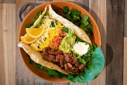 The jumbo taco salad ($12.99) is made with a hand-formed flour taco shell and consists of taco beef, lettuce, tomato, sour cream, cheese and guacamole. (Photos courtesy Belinda Sipp)
