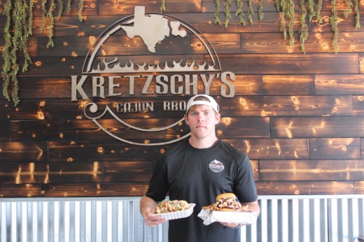 Brandon Kretzschmer owns Kretzschy’s Cajun BBQ with his dad, Steve, and brother, Andrew. (Destine Gibson/Community Impact Newspaper)