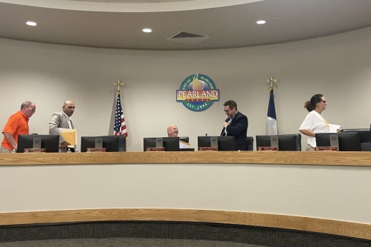 From left, Pearland City Council members Joseph Koza and Alex Kamkar; Mayor Kevin Cole; and council members Adrian Hernandez and Layni Cade gather on the dais. (Andy Yanez/Community Impact Newspaper)