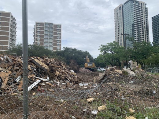 Several buildings have been demolished at the corner of Montrose Boulevard and Kipling Street in Houston as construction crews clear the way for a proposed 36-story apartment project. (Shawn Arrajj/Community Impact Newspaper)