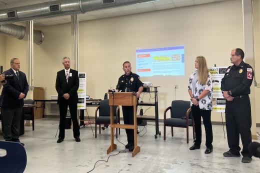 At the podium, Kyle Police Chief Jeff Barnett discusses the three fentanyl student deaths in recent weeks. (Zara Flores/Community Impact Newspaper)