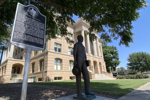Five people behind a dais