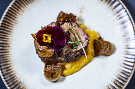 Duck Breast ($22): Duck breast is topped with huckleberry gastrique and sits atop a butternut squash puree. (Courtesy Plane & Level)
