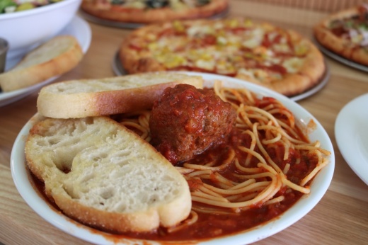 The Italian classic, spaghetti and meatball (13.49) is made with marinara sauce, spaghetti and a hand-rolled meatball. It is also served with garlic bread. (Grant Johnson/Community Impact Newspaper)