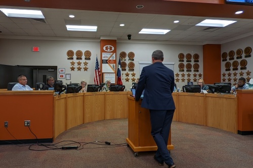 Photo of Chief Financial Officer Glenn Graham speaking with Hutto ISD Trustees at an August 25 meeting
