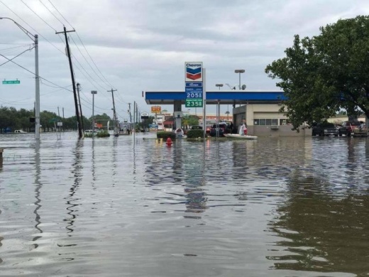 Photo of floodwaters surrounding a gas station
