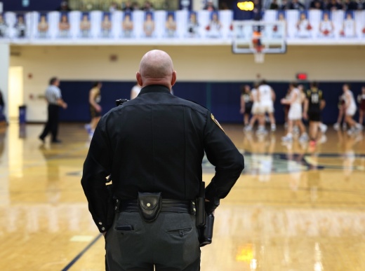Police officer at basketball game