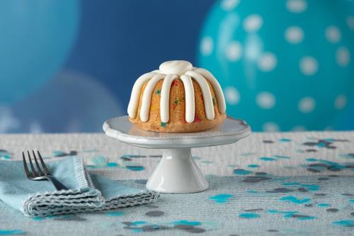 bundt cake on tray with blue background