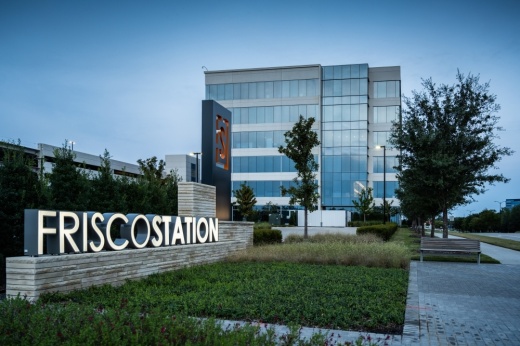 Office building with "Frisco Station" sign
