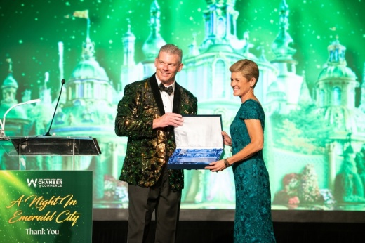 J.J. Hollie (left) president and CEO of The Woodlands Area Chamber of Commerce, presents outgoing Chair Julie Ambler with recognition for her time in the role. (Courtesy Tara Flannery Photography)