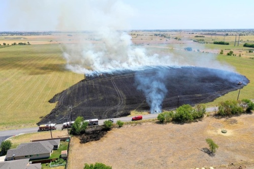 A grass fire burned several acres off Cele Road, east of Pflugerville, on July 14. (Courtesy Travis County Emergency Services District No. 2)