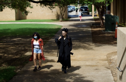 two women walking on college campus