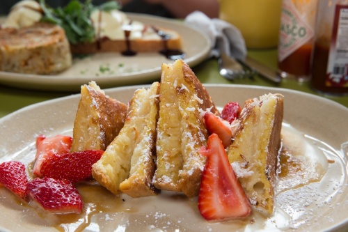 French toast and strawberries on a plate.