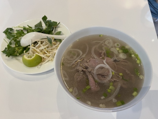 Pho served with thinly sliced steak ($11) is a popular menu item. (Tricia Schwennesen/Community Impact Newspaper)
