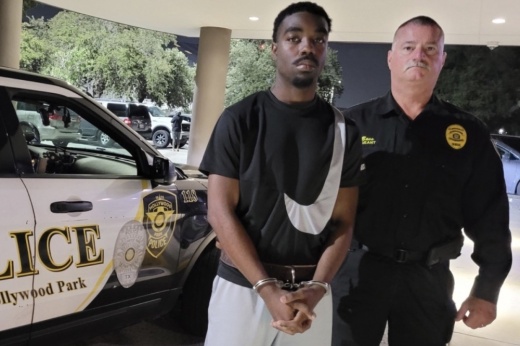 Hollywood Park Police Detective Clint Bass is seen here with Darrick Oliver Jr., who was charged with capital murder in the deaths of two people following a Sept. 11 shooting at a Hollywood Park restaurant. A third person wounded in the shooting is recovering from his injuries, police said. (Courtesy Hollywood Park Police Department)