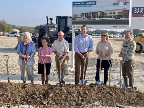 Superintendent Fred Brent (fourth from left) and members of the Georgetown ISD board of trustees were among the stakeholders who broke ground on the future-ready learning center Sept. 14. (Claire Shoop/Community Impact Newspaper)
