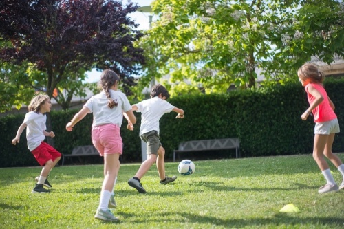 Children playing soccer.
